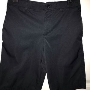 Black Under armour Boy Golf shorts size 16. Great condition.  Rarely worn.